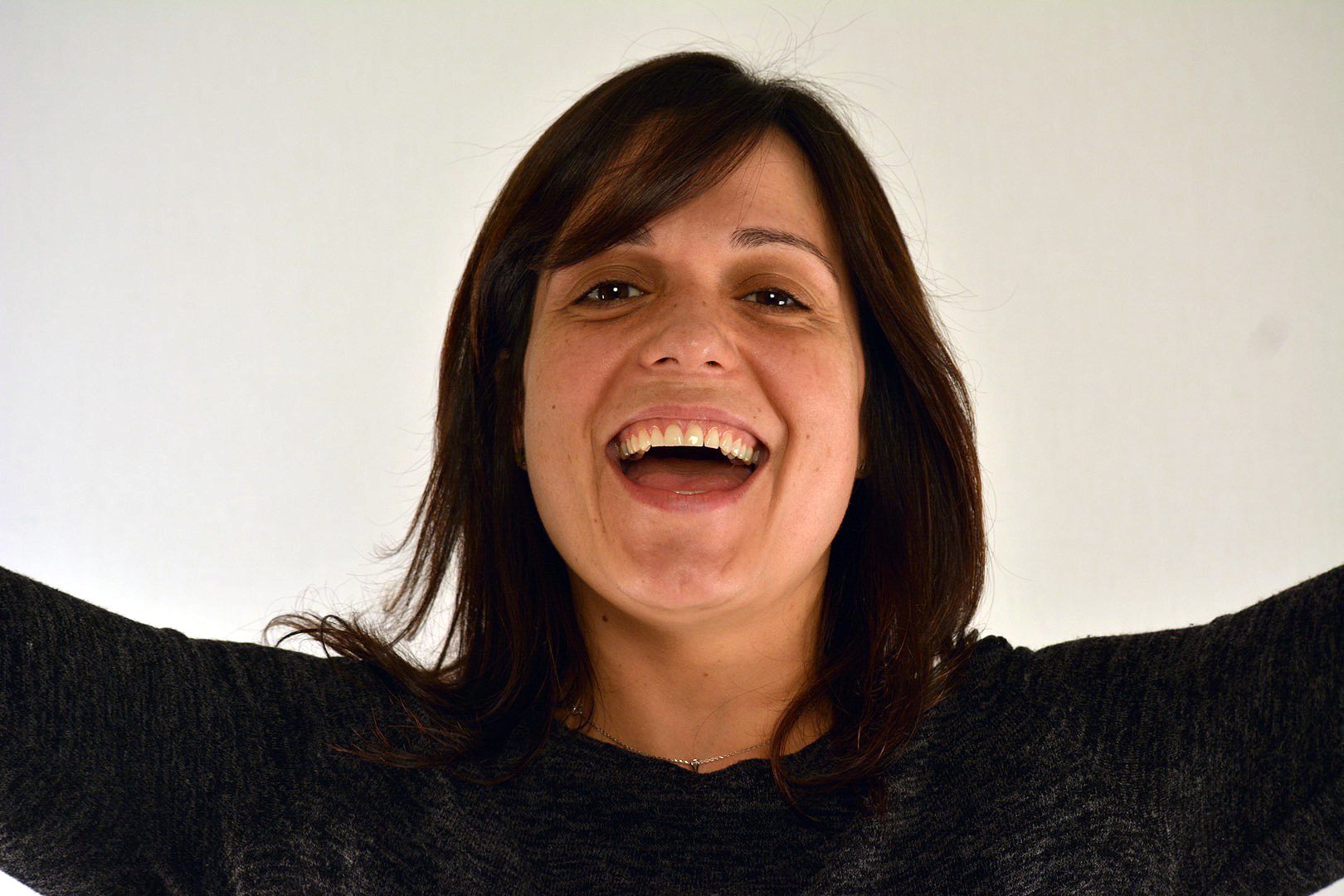 Claudia happy arms raised